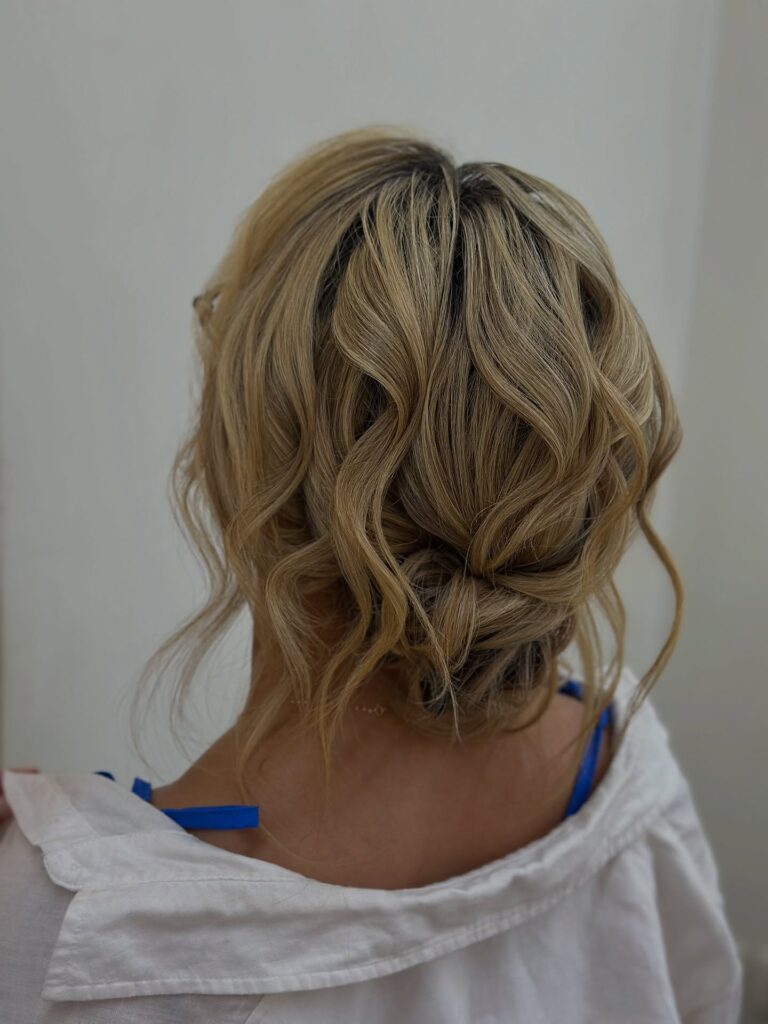 Top 14 Messy Hairstyles for Busy Mornings 13 Messy Low Bun with Soft Highlights