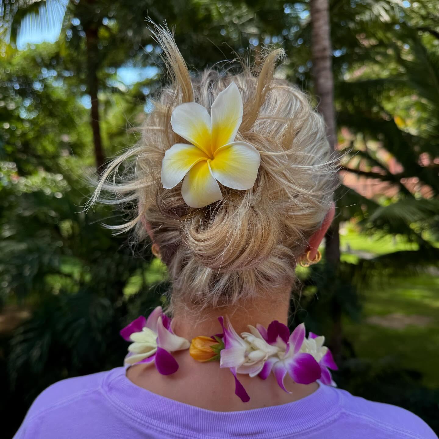15 Best Date Night Hairstyles You Can Do at Home 6 Messy Bun with Fresh Flower Pin