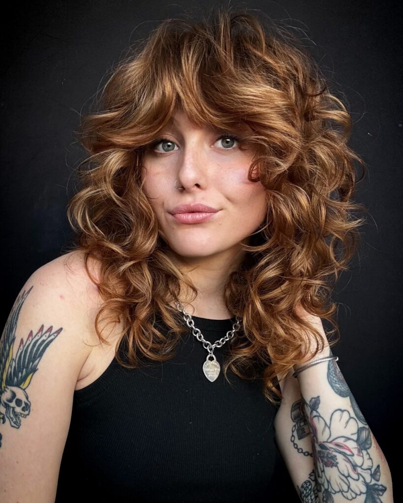 10 Stunning Butterfly Haircut Ideas for a Fresh & Flowy Look 7 Wavy Butterfly Cut for Curly Hair