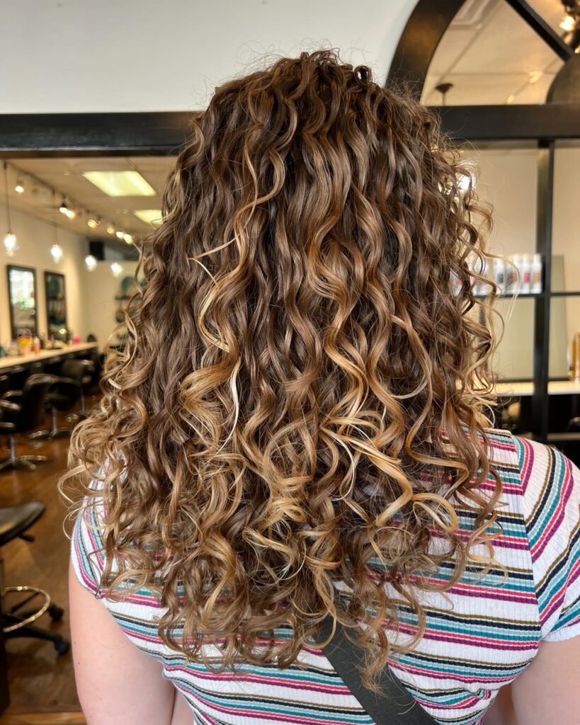 15 Chic Fall Haircuts to Try This Season 11 Layered Cut for Curly Hair