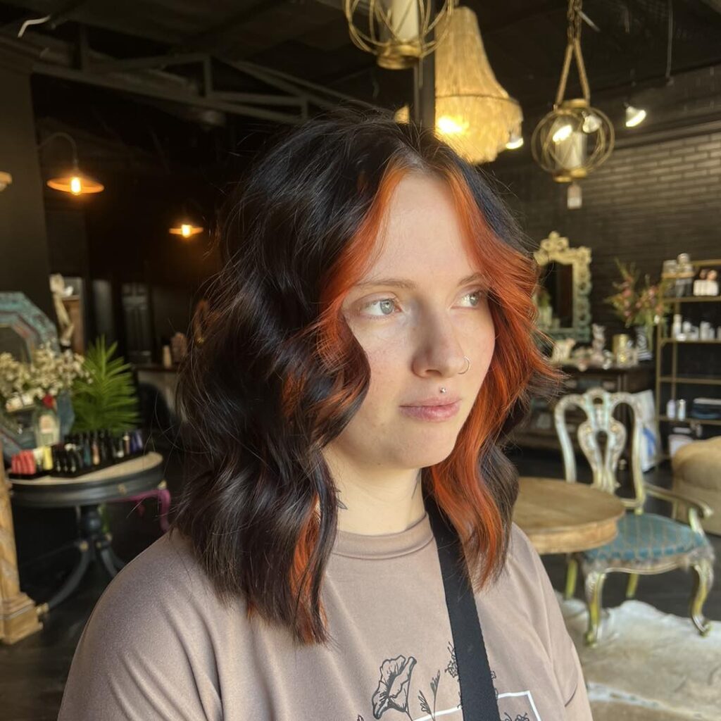 10 Spooky Halloween Hair Colors to Try This Year 7 Fiery Orange Face-Framing Highlights