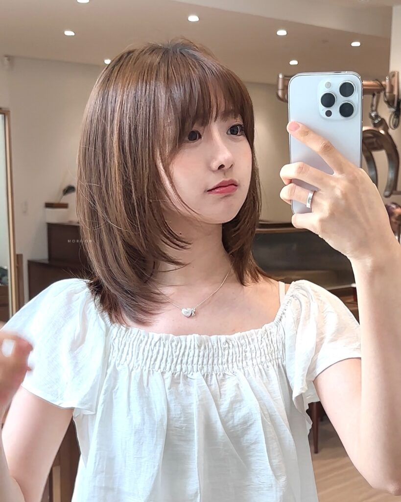 Butterfly Cut Bob with Face-Framing Layers