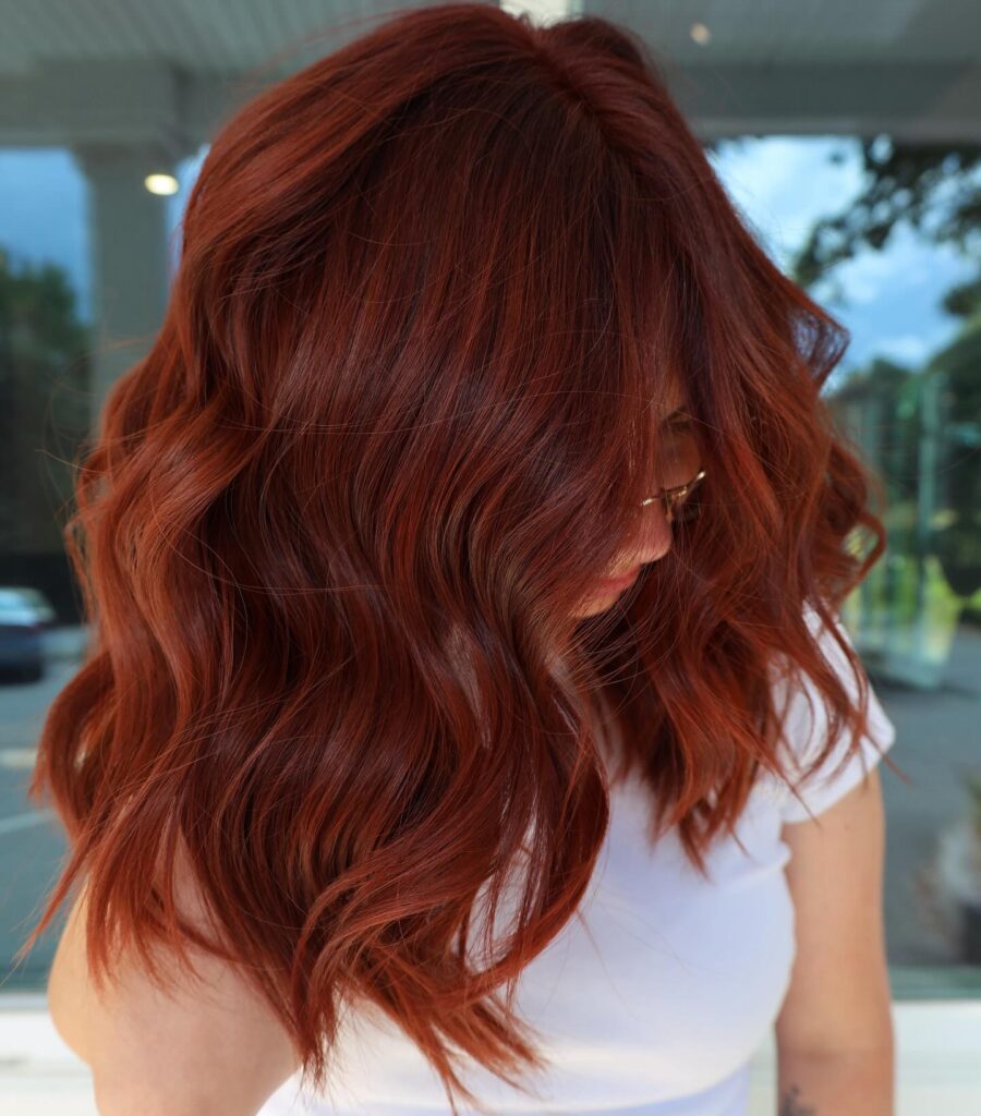 9 70s Feathered Hair Trends for Modern Days 4 Deep Auburn Waves