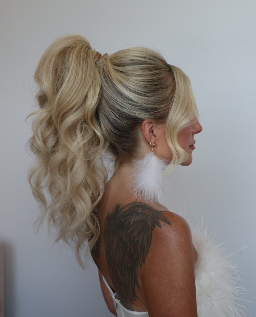 12 Best Wedding Hairstyles in 2025: From Chic Updos to Flowing Waves 4 Glamorous Voluminous Ponytail