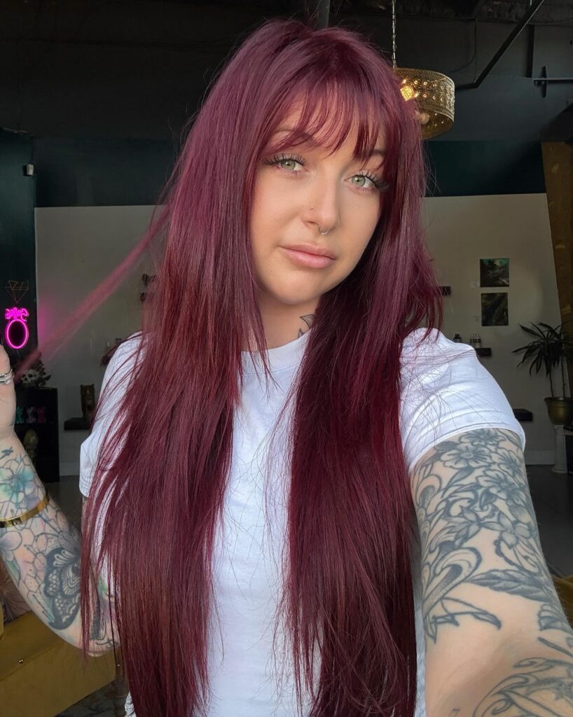 9 70s Feathered Hair Trends for Modern Days 2 Velvet Plum Flow