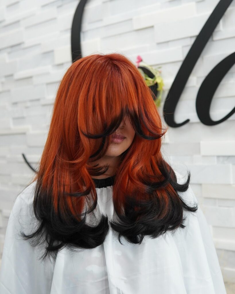 9 70s Feathered Hair Trends for Modern Days 6 Fiery Raven Layers