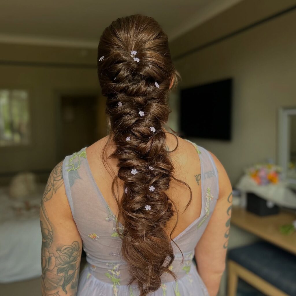 12 Best Wedding Hairstyles in 2025: From Chic Updos to Flowing Waves 12 Whimsical Garden Braid