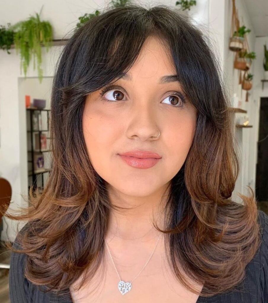 Mid-Length Layers with Curtain Bangs